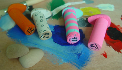 Behind the scenes: Painted wooden character figures. At lower left: spare heads.